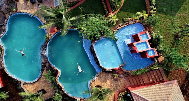 swimming pool for men, women, and children at Fazlani Nest Cottages in Lonavala