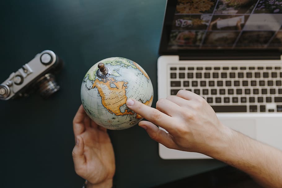 laptop and globe for travelers