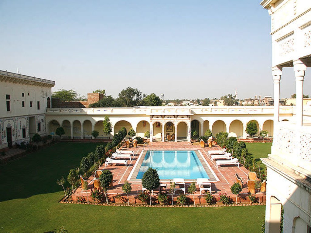 Grab a drink by the pool at this royal getaway from Delhi 