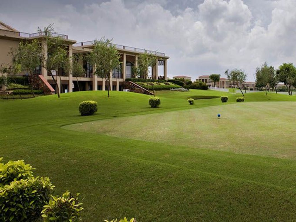 Manicured lawns and nine-hole golf course at a luxurious weekend getaway from Delhi